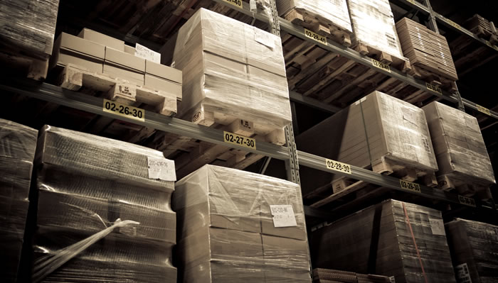 Wrapped boxes on warehouse shelves